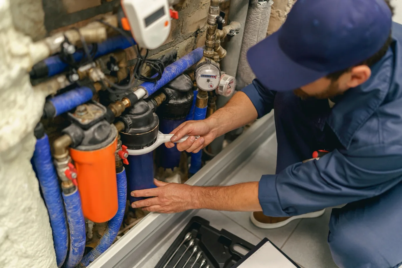 Plumber on a domestic call-out fitting a new bathroom installation
