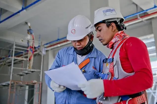 two field engineers doing a safety check at an oil and gas rafinery