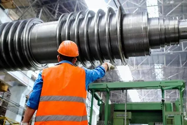 field service engineer doing maintenance checks at manufacturing plant
