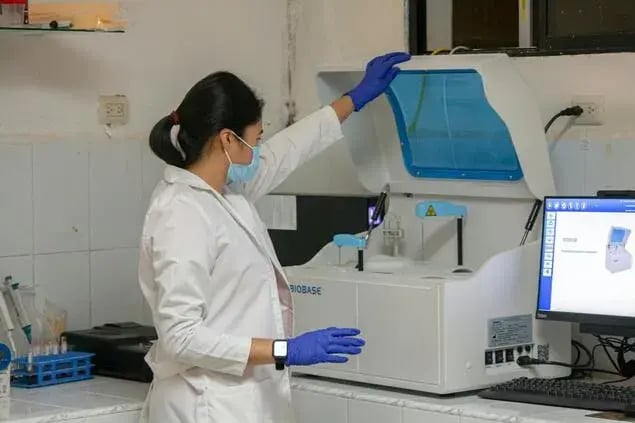 field service engineer testing medical equipment