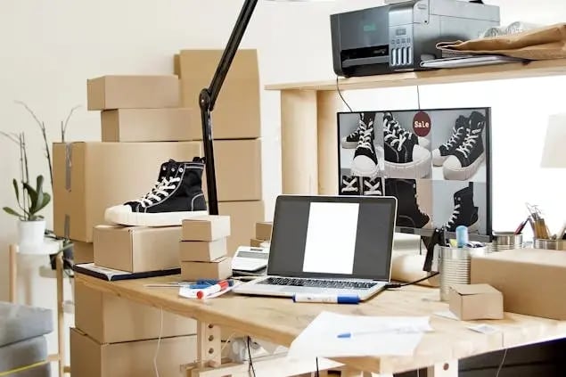 boxes-on-a-desk-surrounding-a-laptop