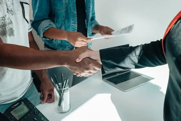 people doing a handshake
