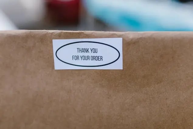 delivered-package-with-thank-you-sticker