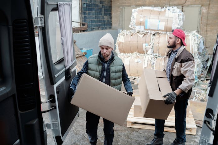 delivery-men-loading-vehicle-with-boxes